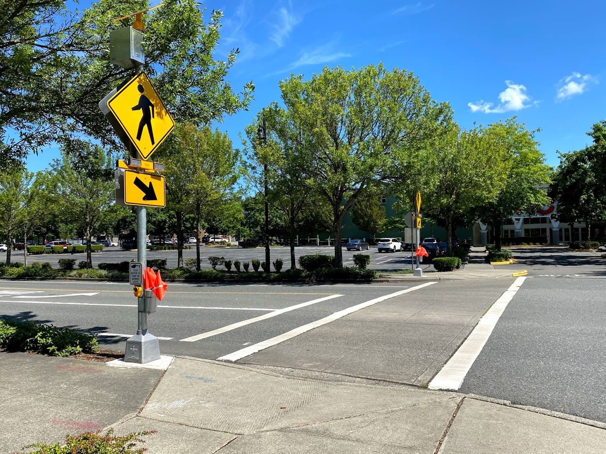 Pedestrian crosswalk flags enhance safety and accessibility in Woodinville.
